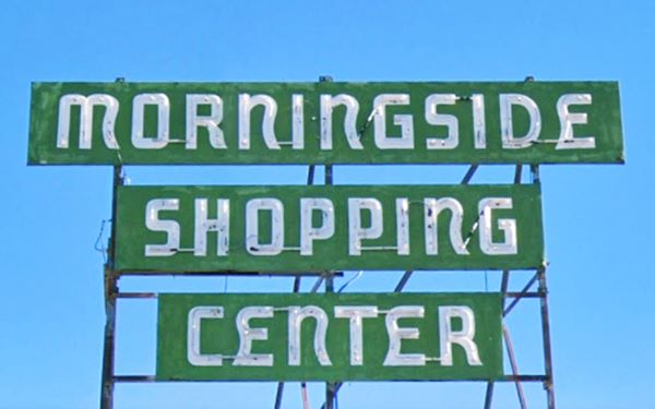 green 1960s neon sign with white letters spelling MORNINGSIDE SHOPPING CENTER
