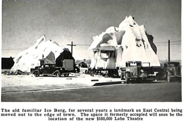black and white image with three 1930s pick ups moving two parts of an iceberg shaped prefab building