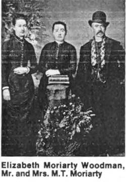 Mr. Moriarty late 1800s black and white image of two women and a man, Mr. Moriarty in late 1800s clothing. Names shown below image