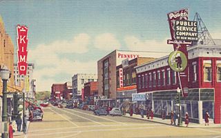 Central Ave. Penney’s, Kress Central Ave. Albuquerque 1940s color postcard Kimo neon sign to the left and buildings on the right along Central Ave: Penney’s, Kress and Gas and Electric CO