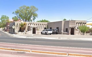 former gas station block building, L-shaped on a corner