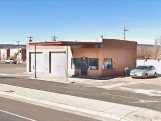 Sebedra Pueblo Texaco service Grants NM US66 former Texaco, flat canopy, vacant pump islands, office right, 2 service bays left, seen from US66