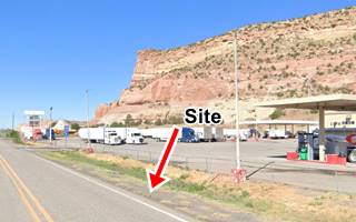 site of State Line Curios nowadays, Manuelito NM cliffs, highway and truck stop color view