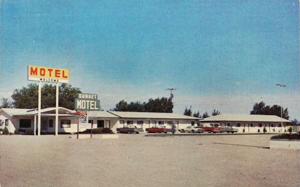 1960s low gable roof motel, neon sign and cars parked seen from US66