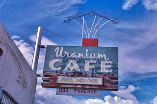 1987 neon sign of Uranium Cafe, Grants, New Mexico, by John Margolies color picture of a 1950s neon sign in blue with white letters spelling URANIUM CAFE