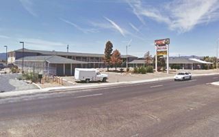 Western Host Motel nowadays Grants NM vacant L shaped layout 2 story gable roof motel and neon sign seen from Route 66