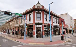 2 story green building on a corner