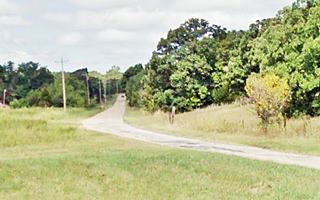 Old 1926-38 Route 66 roadbed Bristow highway among trees and fields