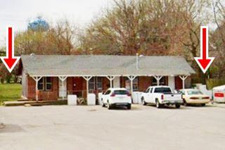 former tourist court in Bristow Route 66 long gable roof building behind a central parking area