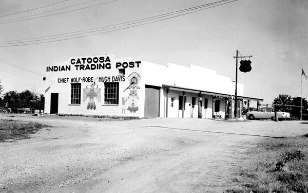 black and white picture trading post and car in the 1950s