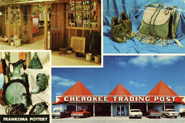 cars, trading post and souvenirs in a 1960s postcard