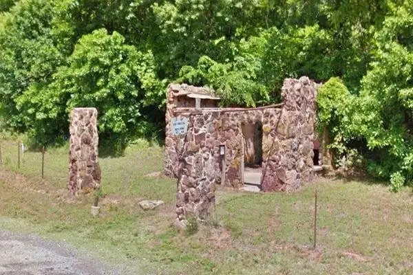 Conoco station ruins on Route 66 Luther Vintage stone service station ruins, no roof, only rock walls