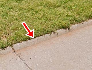 concrete half curb on edge of roadway