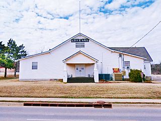 large white hipped roof building