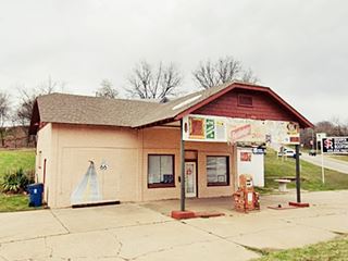 old gas station now a closed grocery store