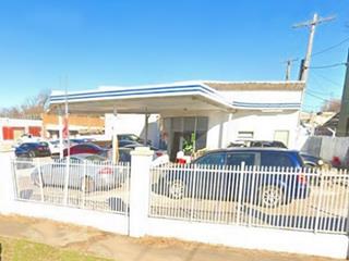 old gas station US 66 Tulsa white enamel panel gas station, flat canopy, 2 blue bands run around canopy and office, cars parked