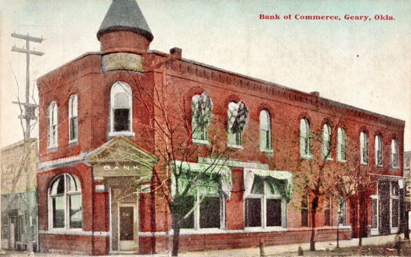 color postcard c.1900s Two story red-brick Building