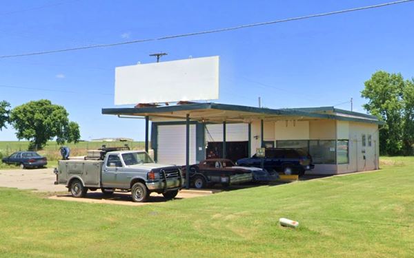 Old gas station, canopy, pumps island and building