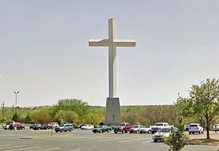 Giant Cross Edmond Route 66 tall white cross over parking lot