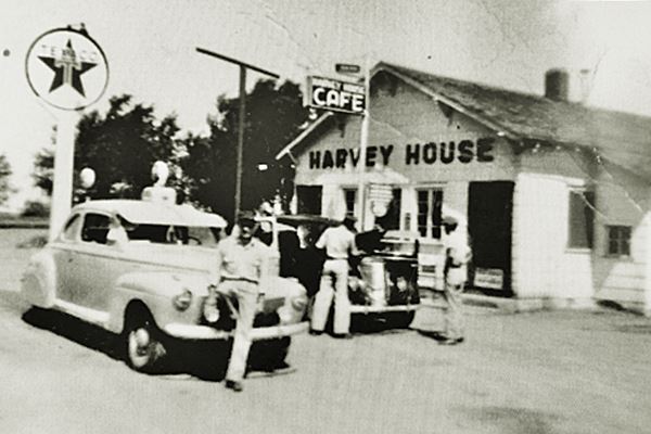 1940s cars at a Texaco, men and gas station black and white picture