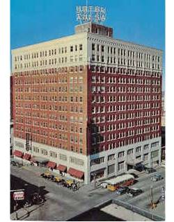 Hotel Tulsa c.1950 color 1950s, taxis and cars below, red brick hotel on a corner seen from the aire; sign atop roof reads HOTEL TULSA