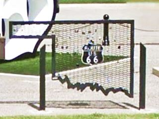 Love locks sculpture Route 66 El Reno steel map of Oklahoma painted black with locks