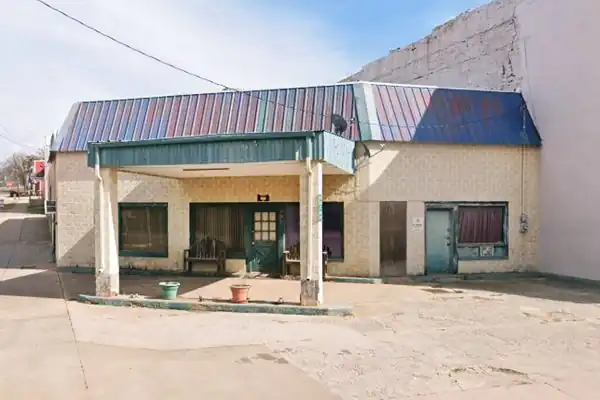 Old 1920s gas station in Luther OK yellow brick 1920s corner gas station