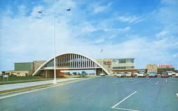 1960s: arch bridge spanning the freeway