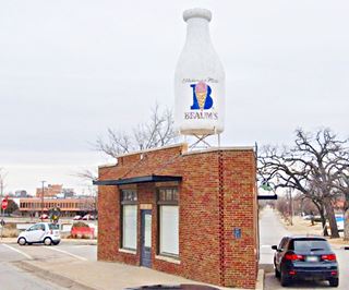 The Milk Bottle Grocery Enormous Milk Bottle atop a Grocery