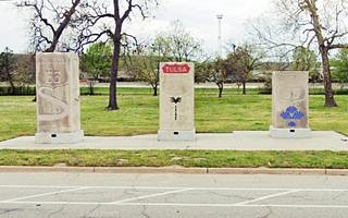 Route 66 monoliths 3 concrete monoliths with US 66 shields, and depictions of Tulsa history