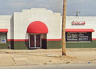 1934 Newton building US 66 Tulsa brick building with interesting laying pattern, one story, white and green, red awnings, pented cornice 19 NEWTON 34 engraved in parapet