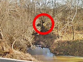 Old 1926-28 bridge abutement Route 66 in Depew a concrete abutement on creek bank among trees in fall