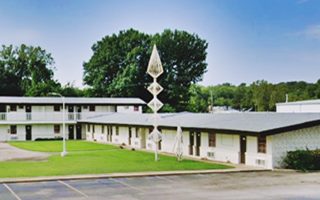 Rio Motel sculpture nowadays Tulsa Rte 66 steel structure in lawn by motel units shaped like abstract spacecraft