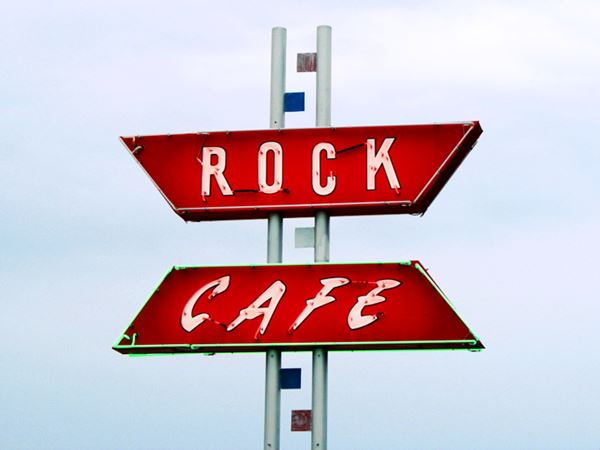 neon sign that reads Rock Cafe