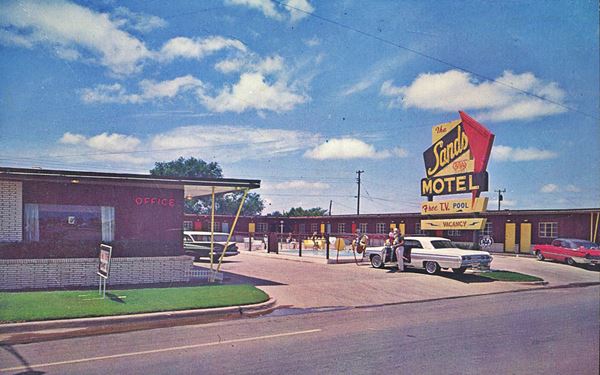 color postcard Sands motel neon sign, building and cars