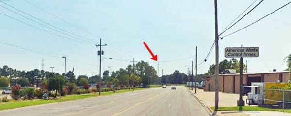 Route 66 West Tulsa four lane highway, trees, some warehouses, cars