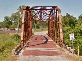 Historic Rock Creek Bridge narrow steel bridge, brick deck