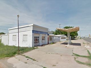Old Sinclair Station Sayre gas station, pump islands and canopy