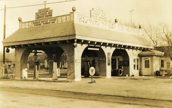 arched canopy gas station black and white postcard 1930s