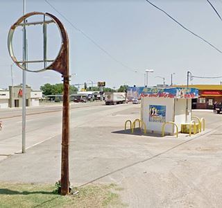 sign of gas station next to Zippy’s
