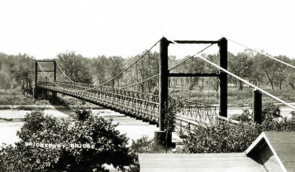 US highway 66 and the suspension toll bridge, Canadian River black and white photo