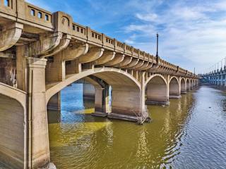 Historic Tulsa Arkansas River Bridge by Damon’s Drohttps://web.facebook.com/photo?fbid=719417873517233&set=pcb.719418050183882enography concrete bridge, slender arches, ornate ribs, muddy river
