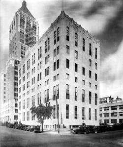 Tulsa Club 1930s black and white, box shaped corner building, cars. c.1930s