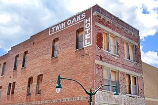 Twin Oaks Hotel Claremore red brick old hotel with name on wall