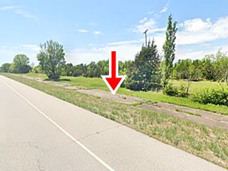 old alignment among the grass next to modern roadbed of US66