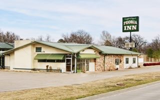 Valley Inn Motel nowadays Tulsa Rte 66 motel with large neon reads PEORIA INN