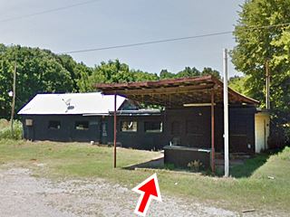 building, canopy, and pump island