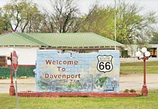 mural painted on low wall-like sign