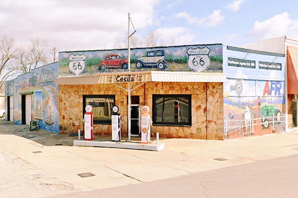 rock faced corner one story gas station