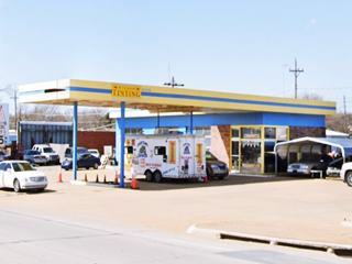 1970s gas station with flat canopy roof